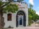 View of 'The High Lonesome' exterior, painted white with black trim around the entrance and signage at 3715 Kalamath St, Denver, CO 80211