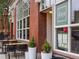 Exterior view of Duo Restaurant with outdoor seating, plants and window displays at 3715 Kalamath St, Denver, CO 80211