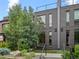 Modern brick home with striking curb appeal, featuring a rooftop deck and manicured landscaping at 3715 Kalamath St, Denver, CO 80211