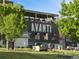 Exterior view of Avanti building featuring a large mural and rooftop patio at 3715 Kalamath St, Denver, CO 80211