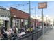 Exterior of Highland Tap and Burger with outdoor seating, string lights, and signage at 3715 Kalamath St, Denver, CO 80211