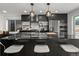 Well-equipped kitchen with large island, bar seating, and modern fixtures at 3715 Kalamath St, Denver, CO 80211