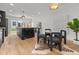 Open-concept kitchen with marble island, modern appliances, and adjacent dining area at 3715 Kalamath St, Denver, CO 80211