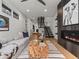 Spacious living room with a modern fireplace, stairs and open floor plan perfect for entertaining at 3715 Kalamath St, Denver, CO 80211