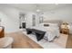 Bright main bedroom with hardwood floors, a comfortable bed, and en-suite bathroom at 3715 Kalamath St, Denver, CO 80211