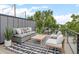 Stylish outdoor deck featuring comfortable seating, a modern rug, and a clear view enhancing the outdoor experience at 3715 Kalamath St, Denver, CO 80211
