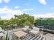 Modern outdoor deck features cozy seating, a sleek rug, and clear railings offering unobstructed views at 3715 Kalamath St, Denver, CO 80211