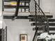 Striking staircase with metal and wood elements, featuring an open and airy design at 3715 Kalamath St, Denver, CO 80211
