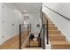 Modern staircase with wood treads and metal railings connects multiple levels in a bright, open space at 3715 Kalamath St, Denver, CO 80211