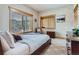 Inviting bedroom with neutral colors and natural light, creating a serene space at 9659 S Turkey Creek Rd, Morrison, CO 80465