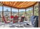Spacious covered deck with a dining table, chairs, and grill with mountain views at 9659 S Turkey Creek Rd, Morrison, CO 80465