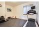 Home gym with workout equipment and a large window for natural light at 9659 S Turkey Creek Rd, Morrison, CO 80465