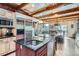 Modern kitchen with a large island, stainless steel appliances, an open design, and a scenic view at 9659 S Turkey Creek Rd, Morrison, CO 80465