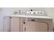 A front-facing perspective showcasing the modern Maytag washer and dryer set at 9659 S Turkey Creek Rd, Morrison, CO 80465