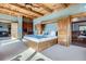 This stunning main bedroom features built-in cabinets surrounding the bed and includes a doorway to the main bathroom at 9659 S Turkey Creek Rd, Morrison, CO 80465