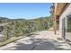 Outdoor patio with mountain views visible from sliding glass doors at 9659 S Turkey Creek Rd, Morrison, CO 80465