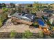 Aerial view showcases property with an in-ground pool, a hot tub, and wrap around decks at 8090 Newton St, Westminster, CO 80031