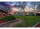 A beautiful backyard with a covered porch, a garden, and a well-maintained lawn at 8090 Newton St, Westminster, CO 80031