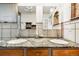 Bathroom vanity featuring stone countertop and dual sinks at 8090 Newton St, Westminster, CO 80031