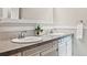 Clean bathroom with dual sink granite countertop vanity at 8090 Newton St, Westminster, CO 80031