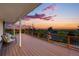 Exterior deck with seating and breathtaking mountain and city views at sunset at 8090 Newton St, Westminster, CO 80031