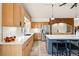 Bright modern kitchen featuring stainless steel appliances, center island, and breakfast bar seating at 8090 Newton St, Westminster, CO 80031