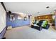 Spacious carpeted Gathering room with movie screen and fireplace at 8090 Newton St, Westminster, CO 80031