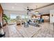 Spacious living room with an open floor plan, large windows offering scenic views, and stylish decor at 8090 Newton St, Westminster, CO 80031