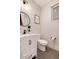Stylish half bath with marble vanity, matte black fixtures, and modern decor at 4711 S Logan St, Englewood, CO 80113