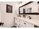 Elegant bathroom with double sinks, granite countertop, and modern fixtures and lighting at 4711 S Logan St, Englewood, CO 80113