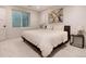Cozy bedroom with neutral decor, a comfortable bed, and natural light from a window at 4711 S Logan St, Englewood, CO 80113