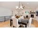 Dining room showcases modern lighting, neutral decor, and an open layout to the living area at 4711 S Logan St, Englewood, CO 80113