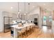 Modern kitchen with gray cabinets, stainless steel appliances, a large island and bar seating at 4711 S Logan St, Englewood, CO 80113