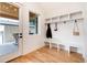 Well-organized mudroom with storage shelves, hooks, and a bench, located near the entrance at 4711 S Logan St, Englewood, CO 80113