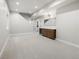 Spacious finished basement with carpet flooring, a wet bar, and modern lighting at 2521 N Gaylord St, Denver, CO 80205