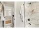 Modern bathroom with a marble-tiled shower, and white marble floors at 2521 N Gaylord St, Denver, CO 80205