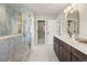 Elegant bathroom features a luxurious blue marble shower and a double sink vanity with modern fixtures at 2521 N Gaylord St, Denver, CO 80205