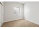Bright bedroom with wood floors, a window, and a closet offering a cozy retreat at 2521 N Gaylord St, Denver, CO 80205
