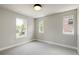 Bedroom with three windows and neutral walls providing ample natural light at 2521 N Gaylord St, Denver, CO 80205