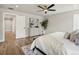 Bright bedroom featuring hardwood floors, a ceiling fan, and a modern dresser at 2521 N Gaylord St, Denver, CO 80205