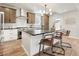 Kitchen island with barstools, modern stainless appliances, and an open layout for easy entertaining at 2521 N Gaylord St, Denver, CO 80205