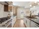 Well-appointed kitchen featuring stainless steel appliances, a gas range, and ample countertop space at 2521 N Gaylord St, Denver, CO 80205