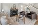 Inviting living room and dining area with a modern fireplace, stylish seating, and open floor plan at 2521 N Gaylord St, Denver, CO 80205