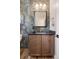 Stylish powder room with unique tile, modern vanity, and sleek fixtures at 2521 N Gaylord St, Denver, CO 80205