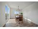 Bright dining room with a modern chandelier and access to a beautiful backyard at 18001 Herrera Dr, Parker, CO 80134