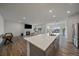 Open concept kitchen with a large island, stainless appliances, and modern finishes at 18001 Herrera Dr, Parker, CO 80134