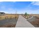 Concrete path leading to community playground with exercise equipment and picnic tables at 18001 Herrera Dr, Parker, CO 80134