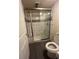 Modern bath with a glass-enclosed shower featuring decorative tile work and a sleek design at 10785 W 63Rd Pl # 105, Arvada, CO 80004