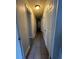 Hallway featuring tile flooring and multiple white doors enhances a clean design throughout at 10785 W 63Rd Pl # 105, Arvada, CO 80004