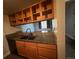 Modern kitchen with granite countertops, stainless steel sink, sleek faucet, and ample cabinet space above and below the counter at 10785 W 63Rd Pl # 105, Arvada, CO 80004